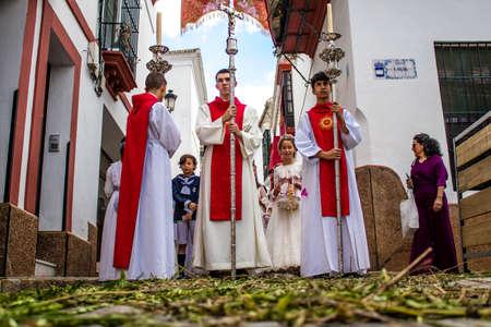 Carmona, Spain - June 19, 2022 Corpus Christi de Carmona, religious procession with young children...