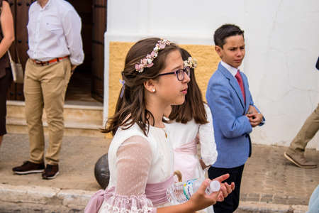Carmona, Spain - June 19, 2022 Corpus Christi de Carmona, religious procession with young children...