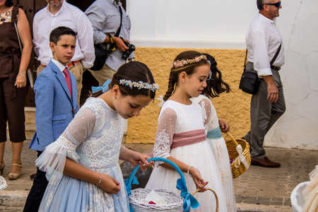 Carmona, Spain - June 19, 2022 Corpus Christi de Carmona, religious procession with young children...
