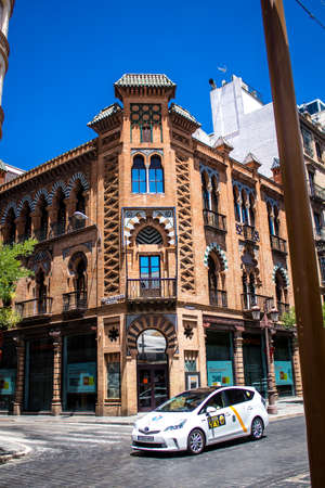 Seville, Spain - July 04, 2022 Facade of a building in the streets of Seville, an emblematic city and the capital of the region of Andalusia, in the south of Spainのeditorial素材