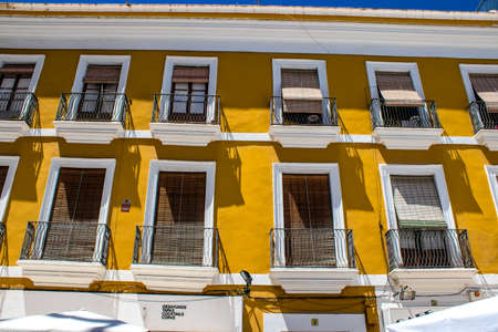 Seville, Spain - July 04, 2022 Facade of a building in the streets of Seville, an emblematic city...
