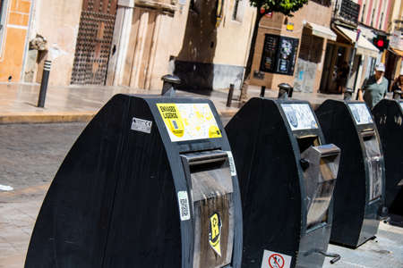 Seville, Spain - July 04, 2022 Garbage container in the streets of Seville, an emblematic city and...