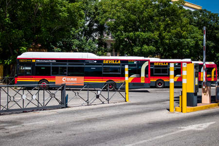 Seville, Spain - July 04, 2022 Bus driving through the streets of Seville during the coronavirus...
