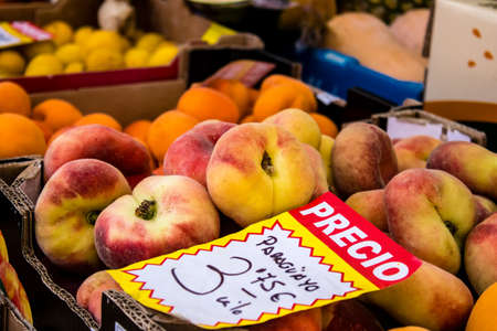 Seville, Spain - July 04, 2022 Vegetables and fruits sold at the Triana market in Seville during the coronavirus outbreak hitting Spain, wearing a mask is mandatoryのeditorial素材