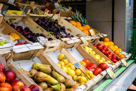 Seville, Spain - July 04, 2022 Vegetables and fruits sold at the Triana market in Seville during the...