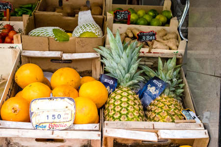 Seville, Spain - July 04, 2022 Vegetables and fruits sold at the Triana market in Seville during the coronavirus outbreak hitting Spain, wearing a mask is mandatoryのeditorial素材