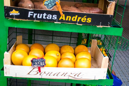 Seville, Spain - July 04, 2022 Vegetables and fruits sold at the Triana market in Seville during the coronavirus outbreak hitting Spain, wearing a mask is mandatoryのeditorial素材