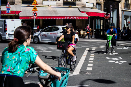 Paris, France - September 12, 2022 People cycling on the streets, bicycles are widely used by Parisians and tourists, many cycle paths are available in the capital to promote this mode of transportのeditorial素材