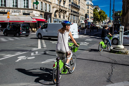 Paris, France - September 12, 2022 People cycling on the streets, bicycles are widely used by Parisians and tourists, many cycle paths are available in the capital to promote this mode of transportのeditorial素材