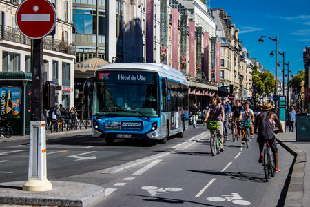 Paris, France - September 14, 2022 Bus driving through the streets of Paris, Buses are inexpensive and drop you off at any location in the capital quite quickly, many of its buses run on gasのeditorial素材