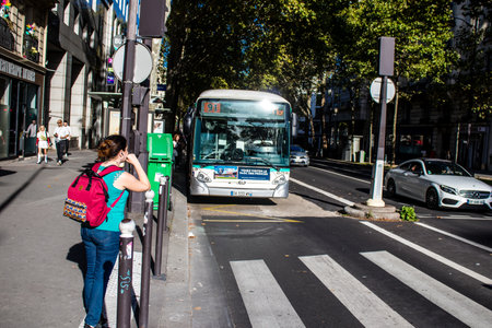 Paris, France - September 14, 2022 Bus driving through the streets of Paris, Buses are inexpensive...