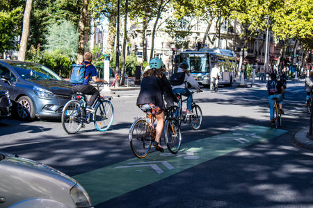 Paris, France - September 12, 2022 People cycling on the streets, bicycles are widely used by Parisians and tourists, many cycle paths are available in the capital to promote this mode of transportのeditorial素材
