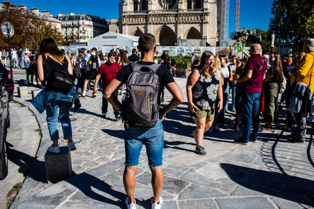 Paris, France - September 14, 2022 Tourists strolling in the streets of Paris, an emblematic city and the capital of Franceのeditorial素材