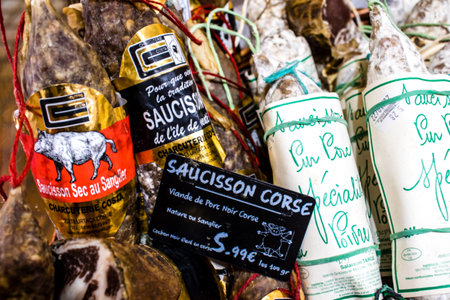 Reims, France - September 17, 2022 Various dry sausages sold in the market of Reims, the sausages...