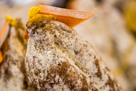 Reims, France - September 17, 2022 Various dry sausages sold in the market of Reims, the sausages are made in an artisanal way with different animal meats, delicatessen is part of the french cuisineのeditorial素材