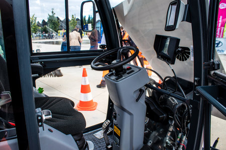 Reims, France - September 17, 2022 Street cleaning cars and garbage truck parked in the streets of...