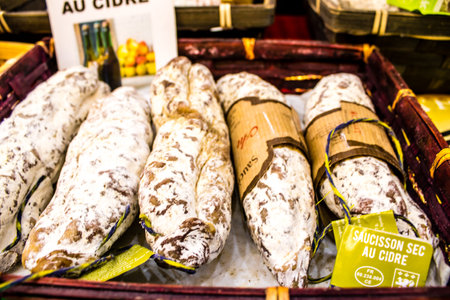 Reims, France - September 17, 2022 Various dry sausages sold in the market of Reims, the sausages...