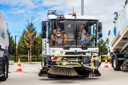 Reims, France - September 17, 2022 Street cleaning cars and garbage truck parked in the streets of Reims taking part in the world day to clean up our planet, garbage collection helps prevent pollutionのeditorial素材