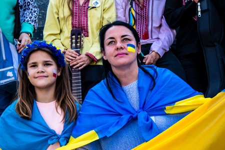 Krakow, Poland - October 08, 2022 Demonstration of Ukrainian people at Rynek GÅowny Square against the invasion of Russia, Poland hosts a large number of refugees due to the proximity of the countryのeditorial素材