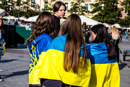 Krakow, Poland - October 08, 2022 Demonstration of Ukrainian people at Rynek GÅowny Square against the invasion of Russia, Poland hosts a large number of refugees due to the proximity of the countryのeditorial素材
