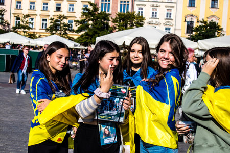 Krakow, Poland - October 08, 2022 Demonstration of Ukrainian people at Rynek GÅowny Square against the invasion of Russia, Poland hosts a large number of refugees due to the proximity of the countryのeditorial素材