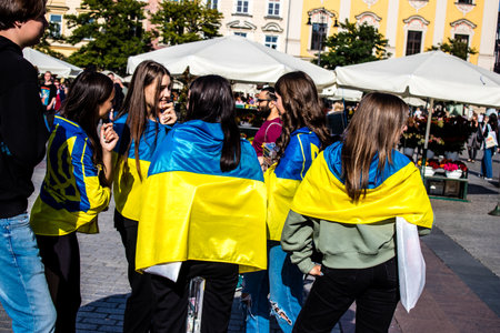 Krakow, Poland - October 08, 2022 Demonstration of Ukrainian people at Rynek GÅowny Square against the invasion of Russia, Poland hosts a large number of refugees due to the proximity of the countryのeditorial素材
