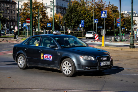 Krakow, Poland - October 08, 2022 Taxi driving in the streets of Krakow and part of the transport system of the city, several taxi companies compete for this activity and the fares are not expensiveのeditorial素材