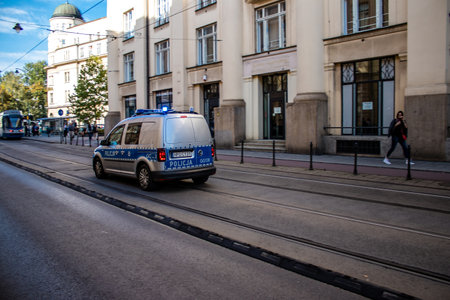 Krakow, Poland - October 08, 2022 Police car driving in the city center of Krakow in Polandのeditorial素材