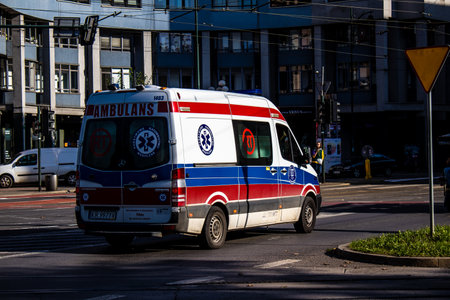 Krakow, Poland - October 08, 2022 Ambulance driving in the city center of Krakow in Poland during the coronavirus outbreak, wearing a mask is not compulsory on the streetのeditorial素材