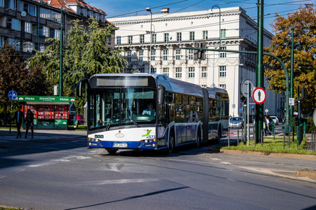 Krakow, Poland - October 08, 2022 Bus driving in the streets of Krakow and part of the transport system of the city, the fares are not expensiveのeditorial素材