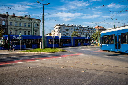 Krakow, Poland - October 08, 2022 Modern electric tram driving in the streets of Krakow and part of the transport system of the city, the fares are not expensiveのeditorial素材