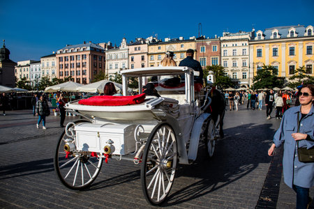 Krakow, Poland - October 08, 2022 Horse drawn carriage rides have become one of the main attractions in Krakow. Their very beautiful horse drawn carriages will take you around the city centerのeditorial素材