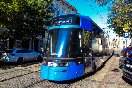 Krakow, Poland - October 08, 2022 Modern electric tram driving in the streets of Krakow and part of the transport system of the city, the fares are not expensiveのeditorial素材