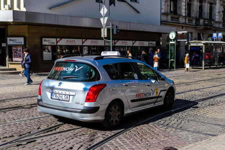 Krakow, Poland - October 08, 2022 Taxi driving in the streets of Krakow and part of the transport system of the city, several taxi companies compete for this activity and the fares are not expensiveのeditorial素材