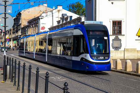 Krakow, Poland - October 08, 2022 Modern electric tram driving in the streets of Krakow and part of the transport system of the city, the fares are not expensiveのeditorial素材