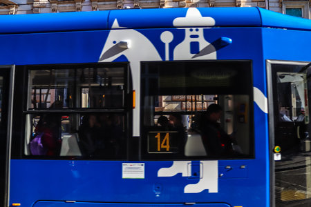 Krakow, Poland - October 08, 2022 Modern electric tram driving in the streets of Krakow and part of the transport system of the city, the fares are not expensiveのeditorial素材