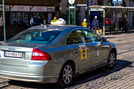 Krakow, Poland - October 08, 2022 Taxi driving in the streets of Krakow and part of the transport system of the city, several taxi companies compete for this activity and the fares are not expensiveのeditorial素材