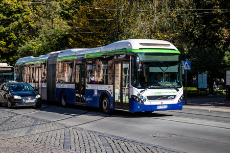 Krakow, Poland - October 08, 2022 Bus driving in the streets of Krakow and part of the transport system of the city, the fares are not expensiveのeditorial素材
