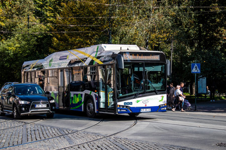 Krakow, Poland - October 08, 2022 Bus driving in the streets of Krakow and part of the transport system of the city, the fares are not expensiveのeditorial素材