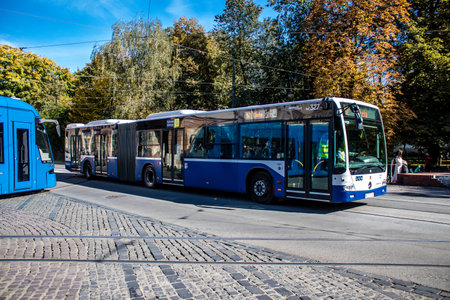 Krakow, Poland - October 08, 2022 Bus driving in the streets of Krakow and part of the transport system of the city, the fares are not expensiveのeditorial素材