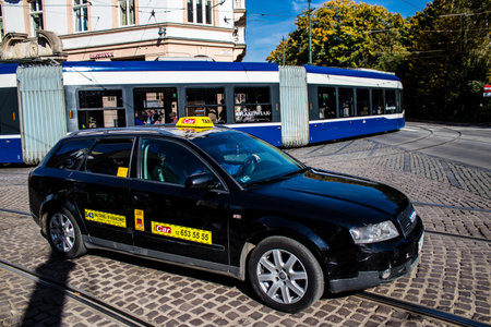 Krakow, Poland - October 08, 2022 Taxi driving in the streets of Krakow and part of the transport system of the city, several taxi companies compete for this activity and the fares are not expensiveのeditorial素材