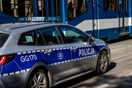 Krakow, Poland - October 08, 2022 Police car driving in the city center of Krakow in Polandのeditorial素材