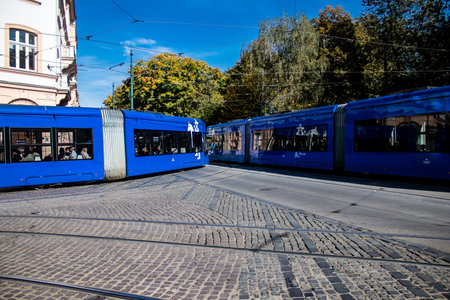 Krakow, Poland - October 08, 2022 Modern electric tram driving in the streets of Krakow and part of the transport system of the city, the fares are not expensiveのeditorial素材
