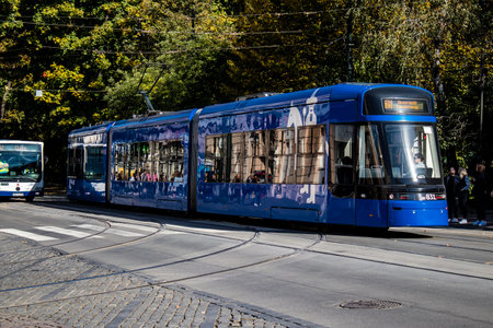 Krakow, Poland - October 08, 2022 Modern electric tram driving in the streets of Krakow and part of the transport system of the city, the fares are not expensiveのeditorial素材