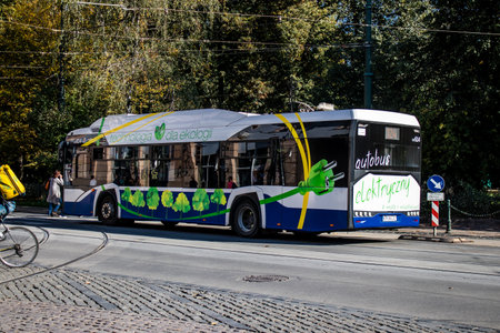 Krakow, Poland - October 08, 2022 Bus driving in the streets of Krakow and part of the transport system of the city, the fares are not expensiveのeditorial素材