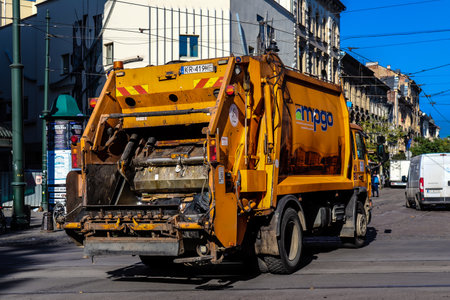 Krakow, Poland - October 08, 2022 Garbage truck driving in the city center of Krakow in Polandのeditorial素材