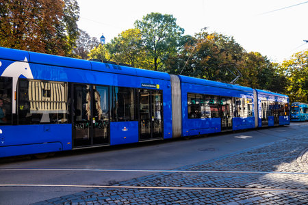 Krakow, Poland - October 08, 2022 Modern electric tram driving in the streets of Krakow and part of the transport system of the city, the fares are not expensiveのeditorial素材