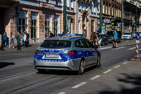 Krakow, Poland - October 08, 2022 Police car driving in the city center of Krakow in Polandのeditorial素材