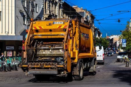 Krakow, Poland - October 08, 2022 Garbage truck driving in the city center of Krakow in Polandのeditorial素材