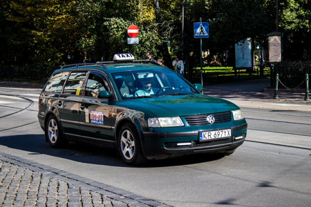 Krakow, Poland - October 08, 2022 Taxi driving in the streets of Krakow and part of the transport system of the city, several taxi companies compete for this activity and the fares are not expensiveのeditorial素材